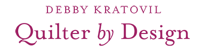 wordmark displaying Debby Kratovil Quilter by Design